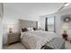 Large main bedroom with king-size bed and a sitting area at 1254 Wispy Cypress Dr, Kissimmee, FL 34746