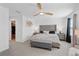 Main bedroom with king bed, walk-in closet, and sitting area at 1254 Wispy Cypress Dr, Kissimmee, FL 34746