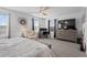 Main bedroom with a king-size bed, a work station and a large TV at 1254 Wispy Cypress Dr, Kissimmee, FL 34746
