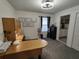 Home office with a large desk, window, and built-in shelving at 1254 Wispy Cypress Dr, Kissimmee, FL 34746