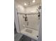 Modern shower with glass enclosure, tile surround, and built-in shelving at 1254 Wispy Cypress Dr, Kissimmee, FL 34746