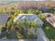 One-story house with a grey roof, surrounded by palm trees at 135 Lemon Grove Dr, Poinciana, FL 34759