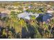Aerial view of home, landscaping, and neighborhood at 135 Lemon Grove Dr, Poinciana, FL 34759