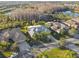 Aerial view of house and surrounding neighborhood at 135 Lemon Grove Dr, Poinciana, FL 34759