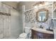 Updated bathroom with a walk-in shower and modern vanity at 135 Lemon Grove Dr, Poinciana, FL 34759