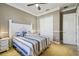 Bright bedroom featuring a queen-size bed and built-in closet at 135 Lemon Grove Dr, Poinciana, FL 34759