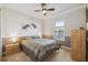 Comfortable bedroom with ceiling fan and ample closet space at 135 Lemon Grove Dr, Poinciana, FL 34759