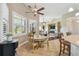 Bright breakfast nook with window seating and view of the living room at 135 Lemon Grove Dr, Poinciana, FL 34759