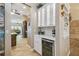 Well-appointed butler's pantry with wine cooler and glass-front cabinets at 135 Lemon Grove Dr, Poinciana, FL 34759