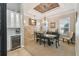 Elegant dining room with a charming chandelier and built-in shelving at 135 Lemon Grove Dr, Poinciana, FL 34759