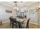 Formal dining room featuring a rustic wooden table and decorative ceiling at 135 Lemon Grove Dr, Poinciana, FL 34759