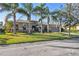 Single-story house with a paver driveway and lush landscaping at 135 Lemon Grove Dr, Poinciana, FL 34759