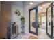 Front entry with a water fountain and view into living room at 135 Lemon Grove Dr, Poinciana, FL 34759
