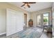 Guest room with a built-in Murphy bed and access to a patio at 135 Lemon Grove Dr, Poinciana, FL 34759