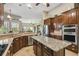 Modern kitchen with stainless steel appliances and large island at 135 Lemon Grove Dr, Poinciana, FL 34759
