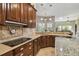 Spacious kitchen featuring granite countertops and custom cabinetry at 135 Lemon Grove Dr, Poinciana, FL 34759