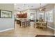 Open kitchen with breakfast bar, custom cabinetry and tile flooring at 135 Lemon Grove Dr, Poinciana, FL 34759
