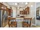 Kitchen with stainless steel appliances and breakfast bar seating at 135 Lemon Grove Dr, Poinciana, FL 34759