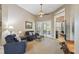 Relaxing living room with comfortable seating and view to backyard at 135 Lemon Grove Dr, Poinciana, FL 34759
