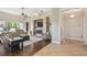 Living room with hardwood floors, fireplace, and built-in shelving at 135 Lemon Grove Dr, Poinciana, FL 34759