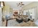 Spacious living room with hardwood floors and access to patio at 135 Lemon Grove Dr, Poinciana, FL 34759