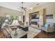 Living area with fireplace, recessed lighting and comfortable seating at 135 Lemon Grove Dr, Poinciana, FL 34759