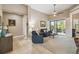 Bright living room with comfy seating and access to a relaxing patio at 135 Lemon Grove Dr, Poinciana, FL 34759