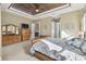 Main bedroom with wooden furniture and an ornate ceiling at 135 Lemon Grove Dr, Poinciana, FL 34759
