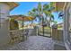 Patio with a table and chairs, and a gate leading to backyard at 135 Lemon Grove Dr, Poinciana, FL 34759