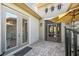Cozy patio with a screened enclosure, and a table with seating at 135 Lemon Grove Dr, Poinciana, FL 34759
