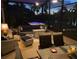 Evening view of screened porch with hot tub at 135 Lemon Grove Dr, Poinciana, FL 34759