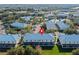 Aerial view showing home location in community with pool and lake at 2015 Grand Oak Dr, Kissimmee, FL 34744