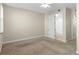 Well-lit bedroom featuring carpeted floors and a ceiling fan at 2015 Grand Oak Dr, Kissimmee, FL 34744