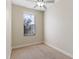 Bright bedroom with neutral walls, carpeting, and window at 2015 Grand Oak Dr, Kissimmee, FL 34744