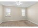 Spacious bedroom with neutral walls, carpeted floors and two windows at 2015 Grand Oak Dr, Kissimmee, FL 34744