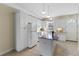 White kitchen with granite island and stainless steel appliances at 2015 Grand Oak Dr, Kissimmee, FL 34744