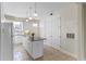 Kitchen with white cabinets, granite island, and stainless steel appliances at 2015 Grand Oak Dr, Kissimmee, FL 34744