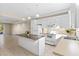 Open concept kitchen with granite island and view into living area at 2015 Grand Oak Dr, Kissimmee, FL 34744
