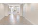 Open concept kitchen and living area with tile floors and white cabinetry at 2015 Grand Oak Dr, Kissimmee, FL 34744