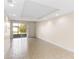 Living area with tile floors and sliding glass doors at 2015 Grand Oak Dr, Kissimmee, FL 34744