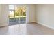 Living room with sliding glass doors to patio at 2015 Grand Oak Dr, Kissimmee, FL 34744