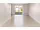 View of living room with sliding glass doors at 2015 Grand Oak Dr, Kissimmee, FL 34744