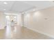 Spacious living room with tile floors and view into kitchen at 2015 Grand Oak Dr, Kissimmee, FL 34744