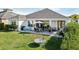 Home with large backyard, patio, and lush landscaping at 2937 Bella Flore Ter, New Smyrna Beach, FL 32168