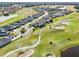 Aerial view of houses and a golf course at 2937 Bella Flore Ter, New Smyrna Beach, FL 32168