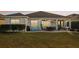 Spacious backyard patio with seating area, grill, and string lights at 2937 Bella Flore Ter, New Smyrna Beach, FL 32168
