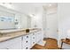 Double vanity bathroom with granite countertop and white cabinets at 2937 Bella Flore Ter, New Smyrna Beach, FL 32168