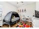 Playful bedroom with a tent bed and colorful rug at 2937 Bella Flore Ter, New Smyrna Beach, FL 32168