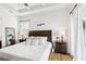 Bright bedroom with king-size bed and access to the backyard at 2937 Bella Flore Ter, New Smyrna Beach, FL 32168
