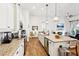 Modern kitchen features granite countertops, white cabinets and stainless steel appliances at 2937 Bella Flore Ter, New Smyrna Beach, FL 32168